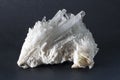 Isolated Scolecite mineral made of sprays of thin, prissmatic needles crystals.