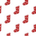 Isolated seamless doodle pattern with red colored christmas socks. White background. Winter holidays backdrop