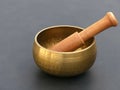 Isolated Shiny Brass Singing Bowl with Wooden Mallet Royalty Free Stock Photo