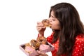An isolated shot of a beautiful caucasian woman eating donut Royalty Free Stock Photo