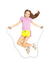 Isolated shot of cute active girl jumping with skipping rope