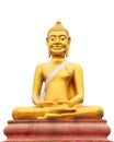 Isolated shot of golden statue of Buddha sit on crossing legs with eyes open.