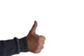 Isolated shot of a human hand showing thumbs up in front of a white background Royalty Free Stock Photo