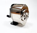 Isolated shot of a retro hand crank pencil sharpener on a white background Royalty Free Stock Photo