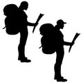 Isolated silhouette of a hiker girl with a map