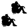 Isolated silhouette of a sitting hiker girl