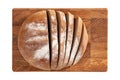 Isolated sliced bread on wooden rectangular cutting board on white background. Royalty Free Stock Photo