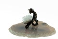 Isolated small metal miner figurine