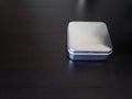 Isolated Plain rectangular tin canister on a dark background holding unknown contents version 2 Royalty Free Stock Photo