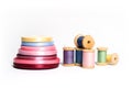 Isolated spools of colored threads with ribbon Royalty Free Stock Photo