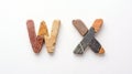 Isolated Stone Letters W and X on White Background