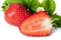 Isolated strawberries. Three fruits, one cut in half on white background Royalty Free Stock Photo