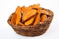 Isolated sweet potatoes in wicker basket. Generative AI