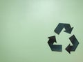 isolated symbol about recycling on a bright green background. symbol made of paper Royalty Free Stock Photo