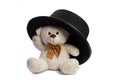 Isolated teddy bear with black hat Royalty Free Stock Photo