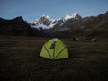 Isolated tent with donkeys mule idyllic mountain camping panorama Cordillera Huayhuash Circuit Ancash Huanuco Peru andes