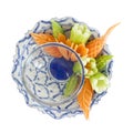 Isolated Thai carving vegetable side disc garnish on white