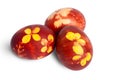 Isolated three Easter eggs colored with onion peel in brown color, with flower pattern, isolated Easter eggs on white background Royalty Free Stock Photo