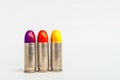 Isolated three lipstick bullet on white