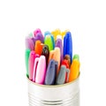 A close up of a can full of colorful pens