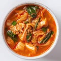 isolated top view kimchi soup in a bowl, korean soup on white background, asian food menu Royalty Free Stock Photo