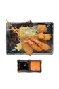 Isolated top view of Mix tempura stick Shrimp, salmon and quail eggs served with slice cabbage, red oak lettuce and sliced lemon Royalty Free Stock Photo