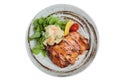 Isolated Top view of Teriyaki chicken served with potato salad, sliced lemon, totmato and green oak in round stone plate Royalty Free Stock Photo