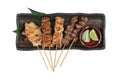 Isolated top view of Yakitori Japanese-Style Grilled Chicken Skewers with chicken and internal organ served with sliced lime. Royalty Free Stock Photo