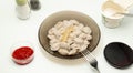 Traditional russian pelmeni, ravioli, dumplings with meat on white background. Design and food styling idea for sale