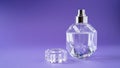 Isolated transparent perfume bottle on purple background. Gift concept. Fragrance spray mock up. Spring scent Royalty Free Stock Photo