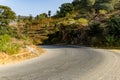 isolated twisted mountain tarmac road at afternoon from flat angle Royalty Free Stock Photo