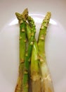 Isolated uncooked asparagus in a plate