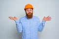 Isolated unsure architect with beard and orange helmet