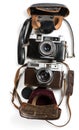 Antique film photo-cameras and cases, top view. Royalty Free Stock Photo