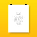 Isolated vertical hanging poster mockup, white blank sheet template on yellow wall