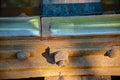 Isolated view of bolts holding rails on vintage railway trestle