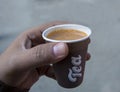 Isolated view of indian masala tea cup holding by male hand Royalty Free Stock Photo