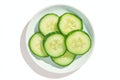 Isolated view of single cucumber slice on white background, plate Royalty Free Stock Photo