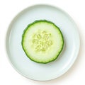 Isolated view of single cucumber slice on white background, plate Royalty Free Stock Photo