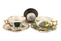 Isolated vintage three footed teacups Royalty Free Stock Photo