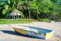 Isolated vintage wooden painted boat on the beach  in Playa Hermosa, Costa Rica, Royalty Free Stock Photo