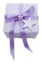 Isolated violet Christmas present wrapped in paper with a star