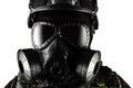 Isolated warrior soldier in gas mask front view closeup