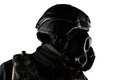 Isolated warrior soldier in gas mask profile view closeup