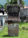 Isolated waruga stone grave with ancient carving model.