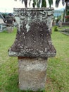 Isolated waruga stone grave with ancient carving model