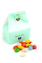 Isolated wedding bonbonniere with candies and wedding rings