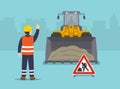 Isolated wheel loader clearing the surface at earthmoving and road works in construction. The worker shows stop gesture.