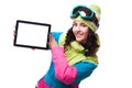 Beautiful young woman in ski outfit and ski goggles hold empty t Royalty Free Stock Photo