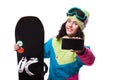 Beautiful young woman in ski outfit and hold snowboard Royalty Free Stock Photo